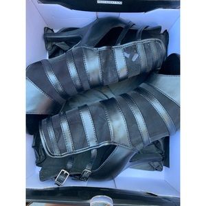 Black open toed leather and mesh heels with ankle buckles